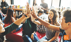 Students giving eachother highfives