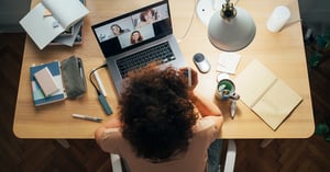 woman sitting in video conference